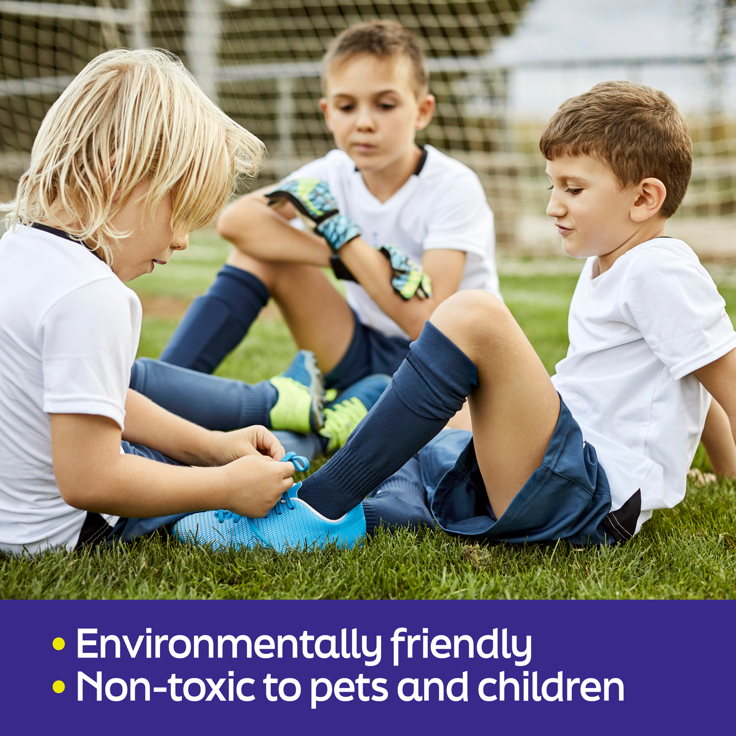 Showcases kids at a soccer game and one of the kids is tying another shoe. SilverWorks! uses this image to showcase that the product is environmentally friendly and non-toxic to pets and children.